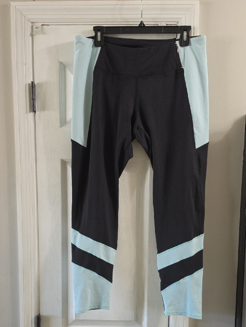 CALIA by Carrie Underwood women's black leggings with light blue accents.